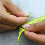 Women measuring her waistline.