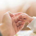 Holding hands with a child