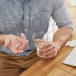 man taking pills for infertility in men