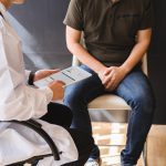 man talking to doctor about infertility in men