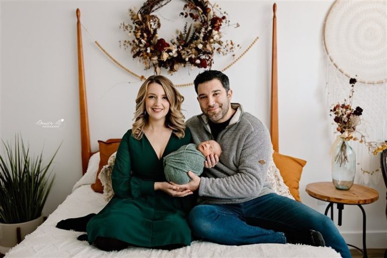 couple holding a baby